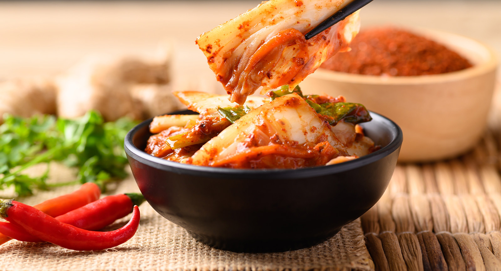 Kimchi being eaten with chopsticks