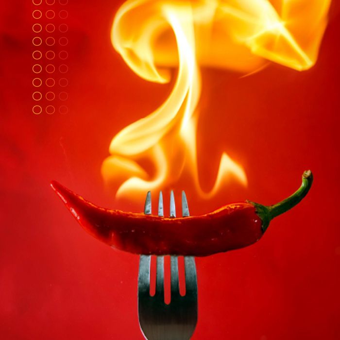 hot-spicy-survey-cover-pepper-700 flaming whole chili pepper on a fork