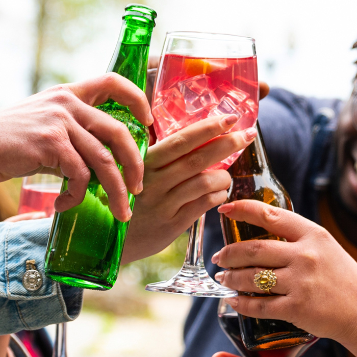 Group of friends toasting NA drinks