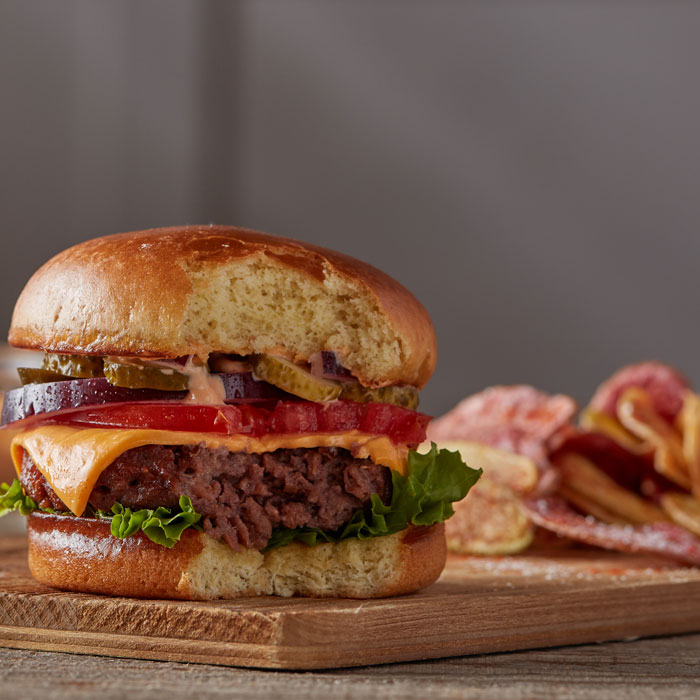 Alternative protein burger patties with typical burger fixings